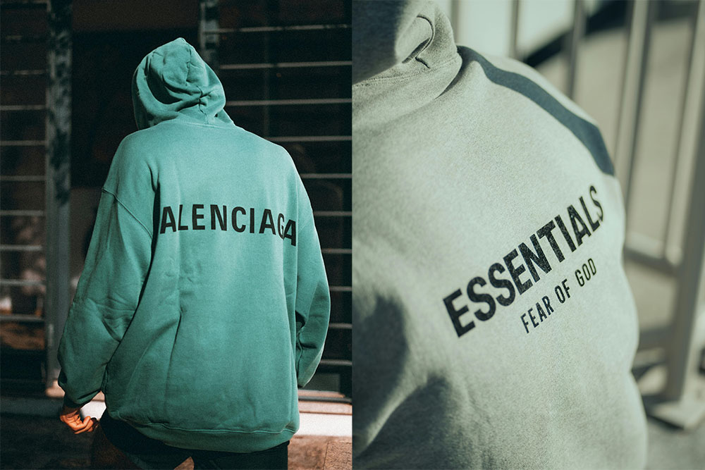 photoshoots showcasing balenicaga and essentials fear of god hoodies in green in the street