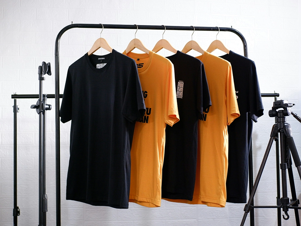 t-shirts hanging on a rack