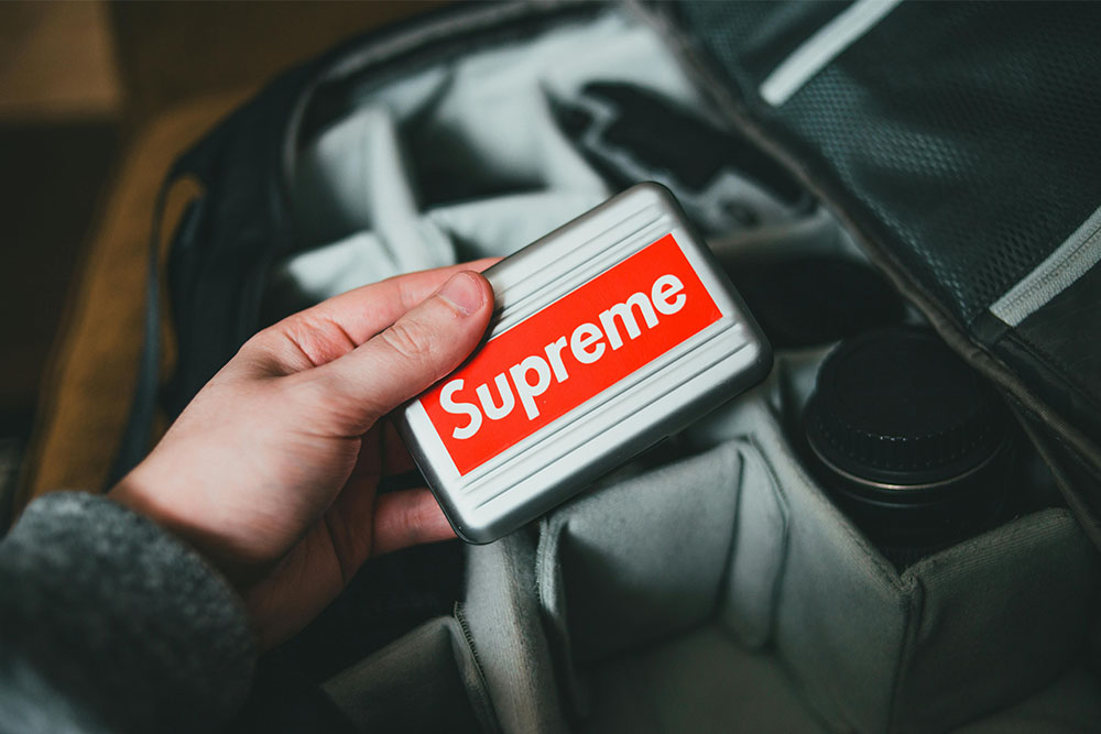 red and white supreme sticker logo how to name your clothing brand